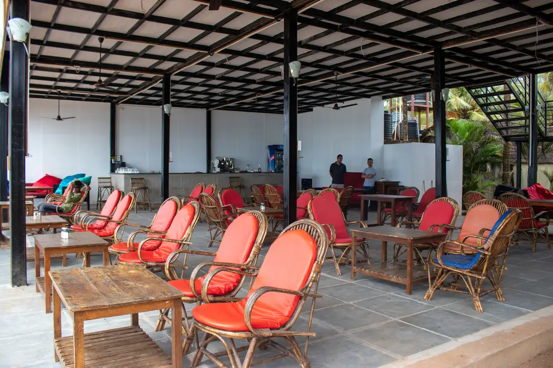 A spacious restaurant featuring numerous chairs and tables arranged for dining.